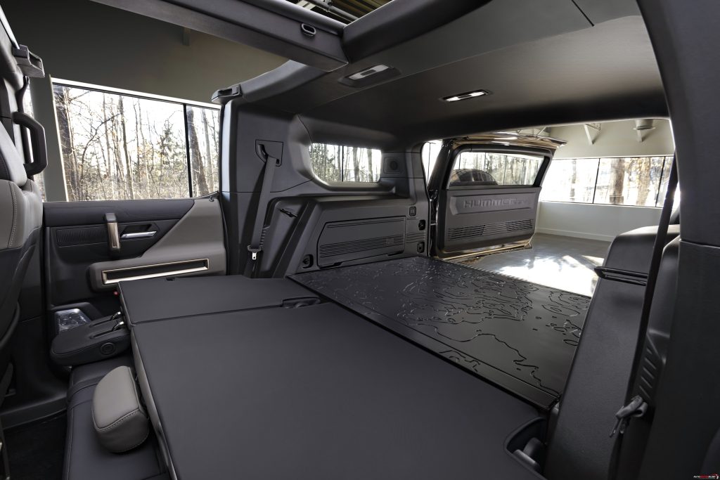 The GMC HUMMER EV SUV debuts in the low contrast Lunar Shadow interior and includes a spacious cargo area and an architecturally inspired cabin.