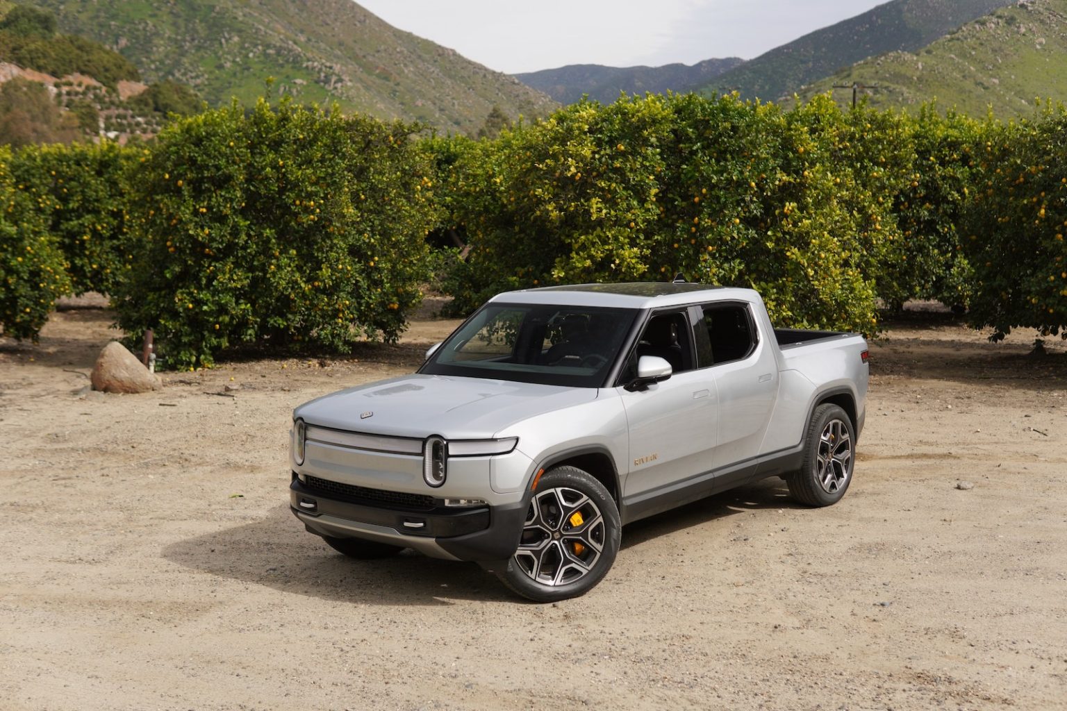 Rivian R1T electric pickup truck in a natural setting